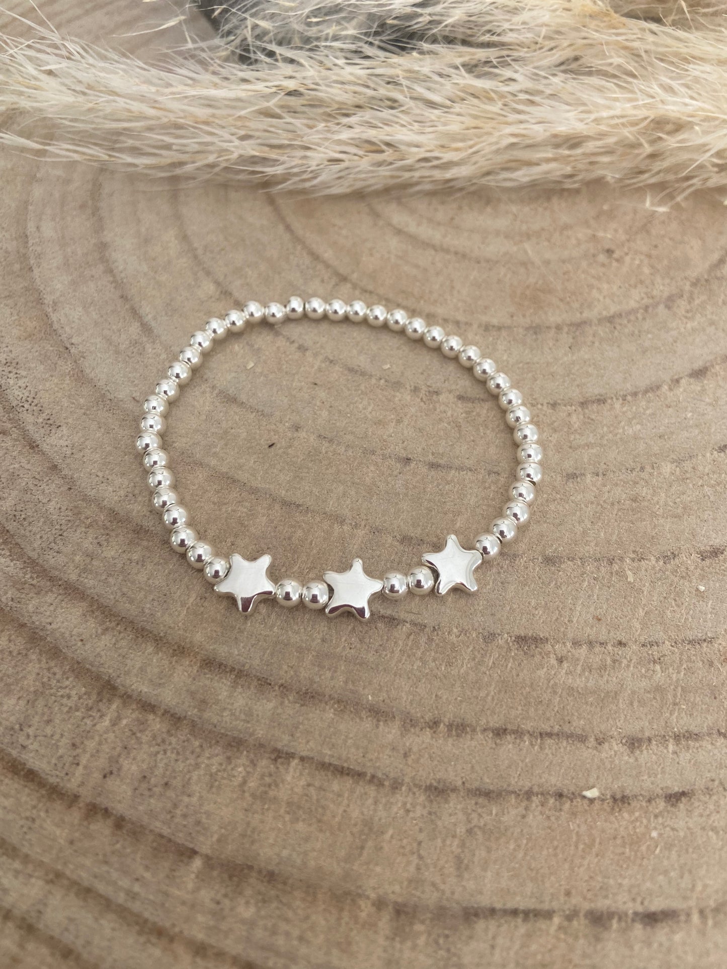 Bracelet argent et trio d’étoiles